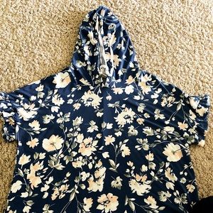 Woman’s blue floral peplum style shirt with hood.